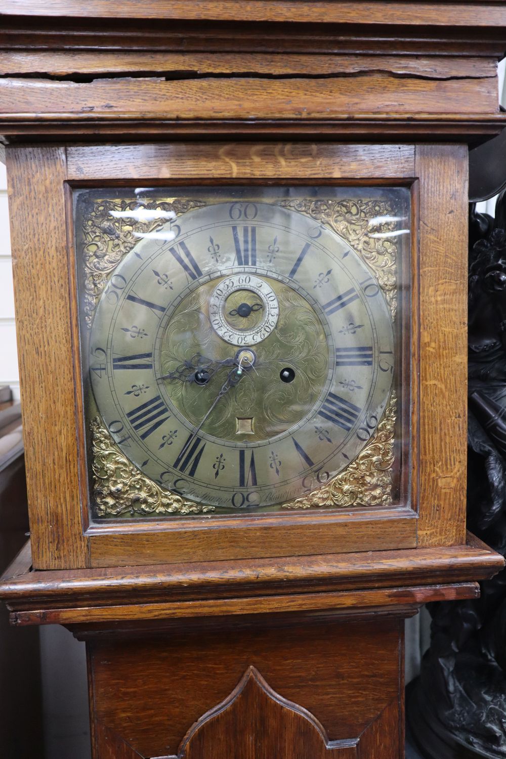 A George III oak 30-hour longcase clock marked Spinney, Blandford